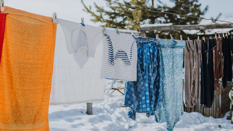 frozen underwear on the street in winter. Snow on the washed linen