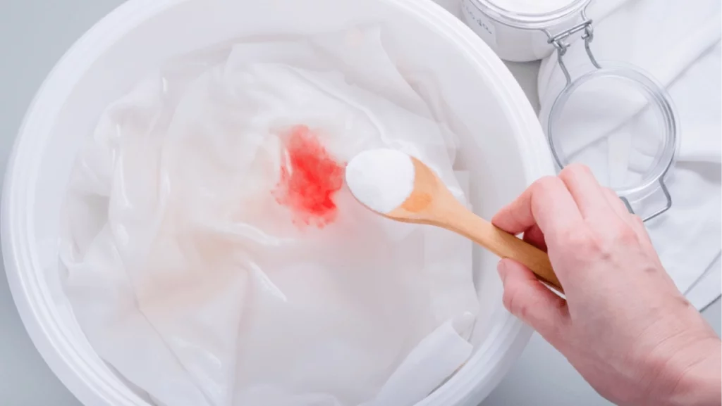 Homemade eco-friendly removing of stains on clothes with baking soda.