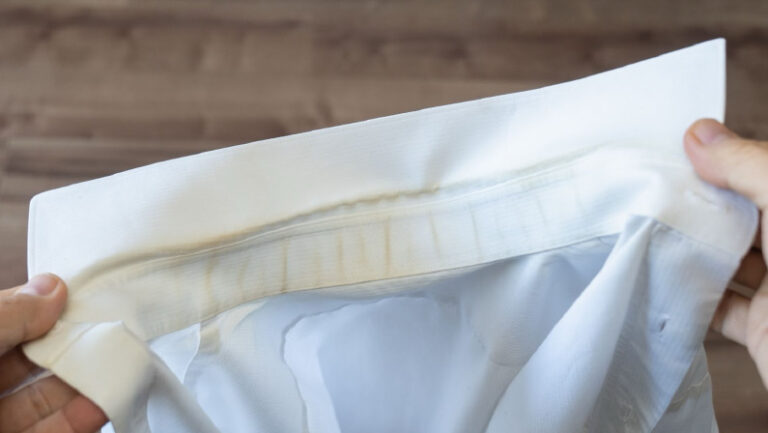White shirt. Dirt on the collar.