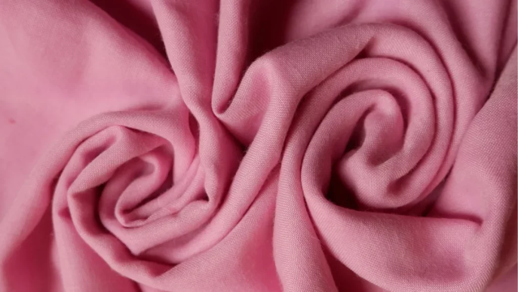 Baby pink color Polyester texture seamless with beautiful closeup detail fabric.