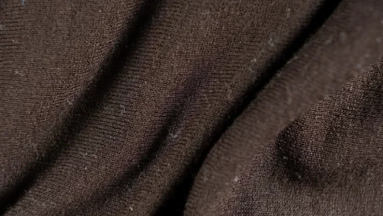 Old shabby synthetic, polyamide and elastane fabric, macro texture.