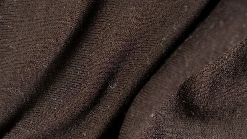 Old shabby synthetic, polyamide and elastane fabric, macro texture.