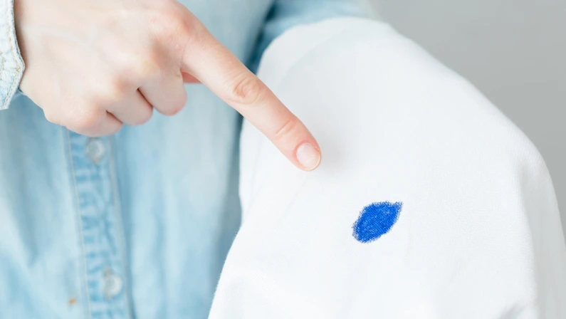 Dirty ink stain on a white clothes. daily life stain concept. High quality photo