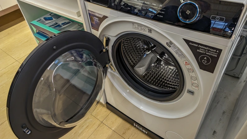 France, March 2 2024: Front Loading Washing Machine in a Domestic Setting