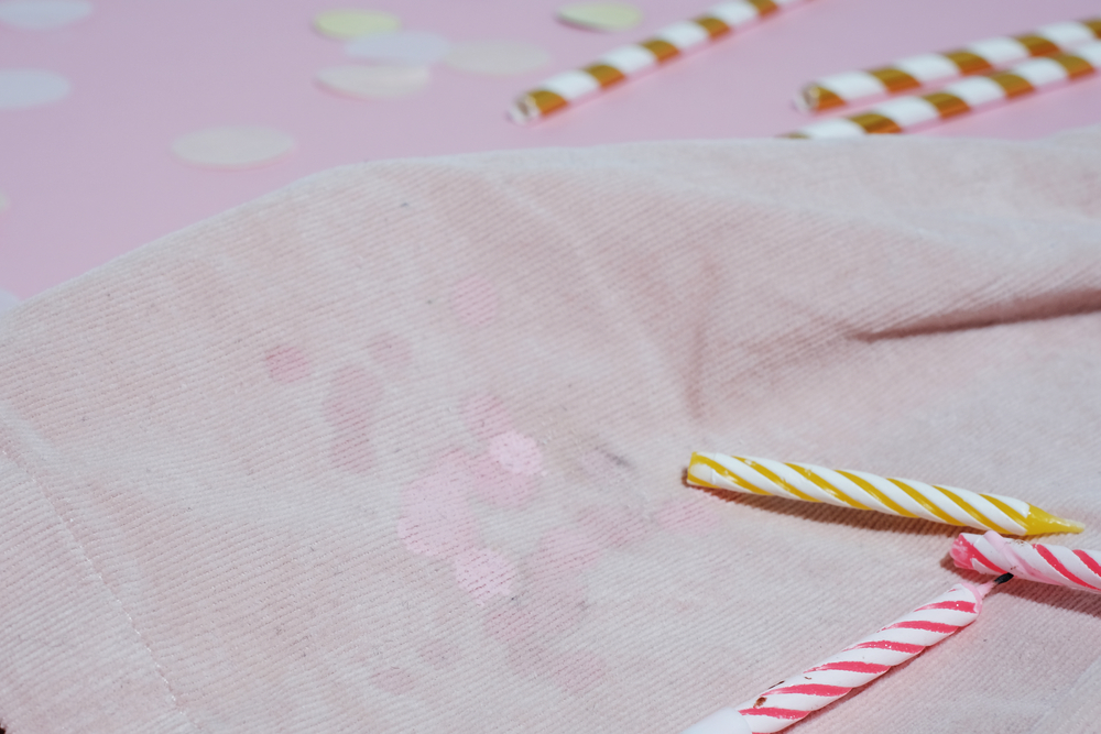 close-up of dripping candle wax stains on clothes