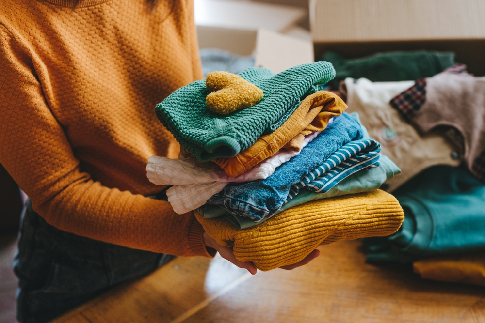 Sorting a pile of winter clothes