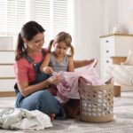 mother and child with fresh laundry clothes