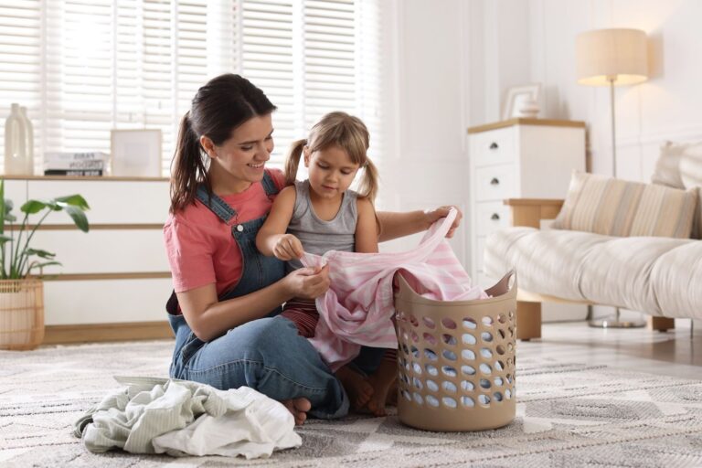 mother and child with fresh laundry clothes