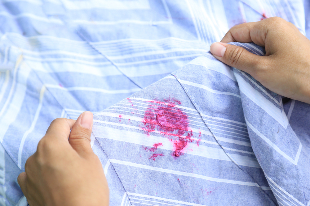 Dirty lipstick stain on cloth fabric from accident in daily life